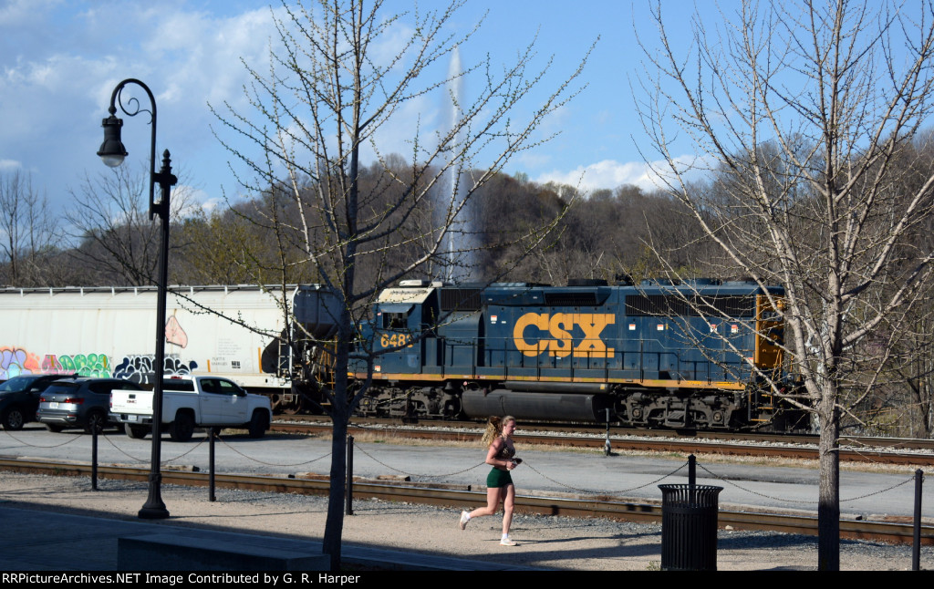 A jogger, CSX local L206, and the Langley Fountain line up for this shot.